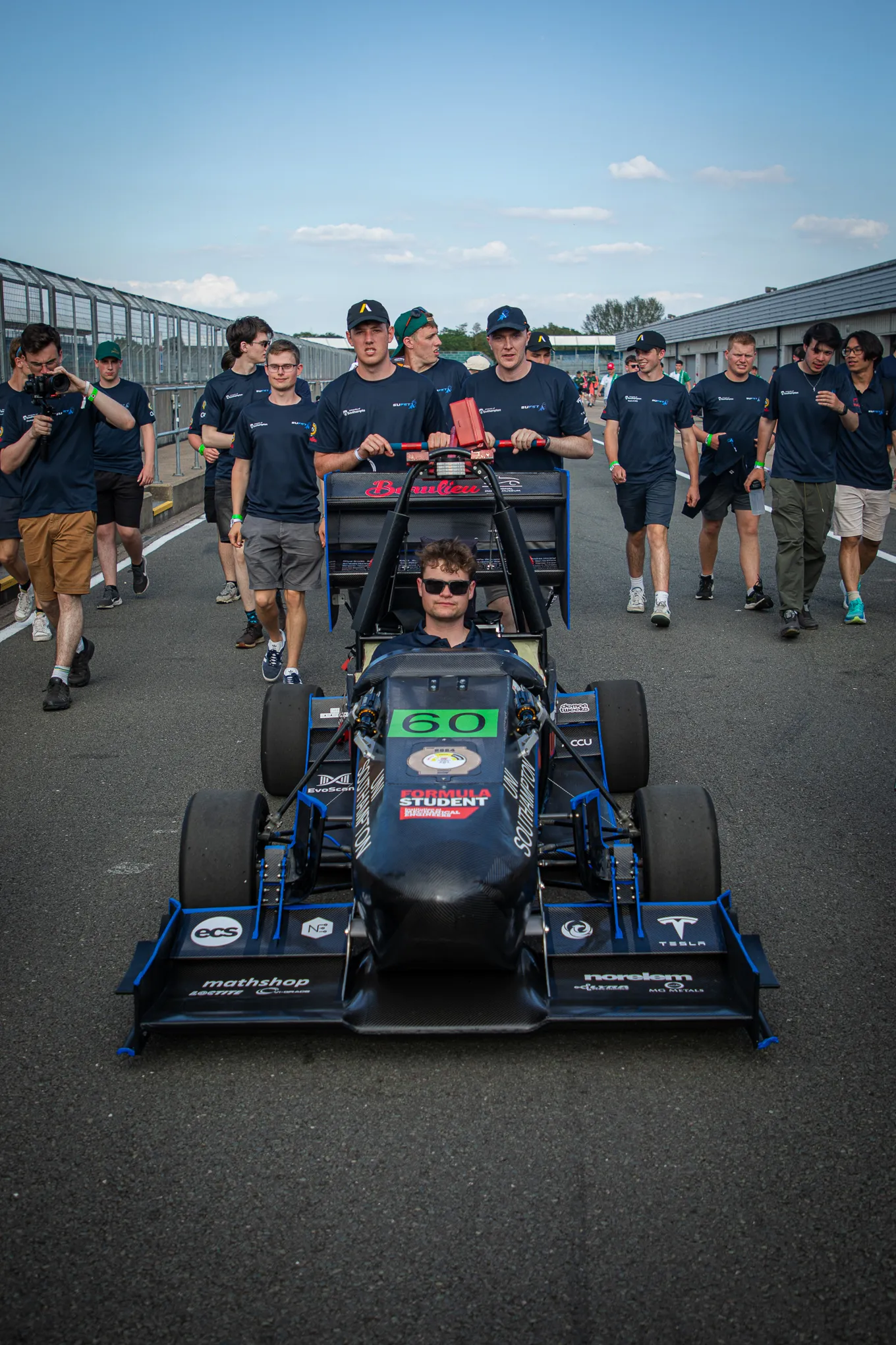 Southampton University Formula Student Car with the Team behind at FSUK 2021 race in Silverstone